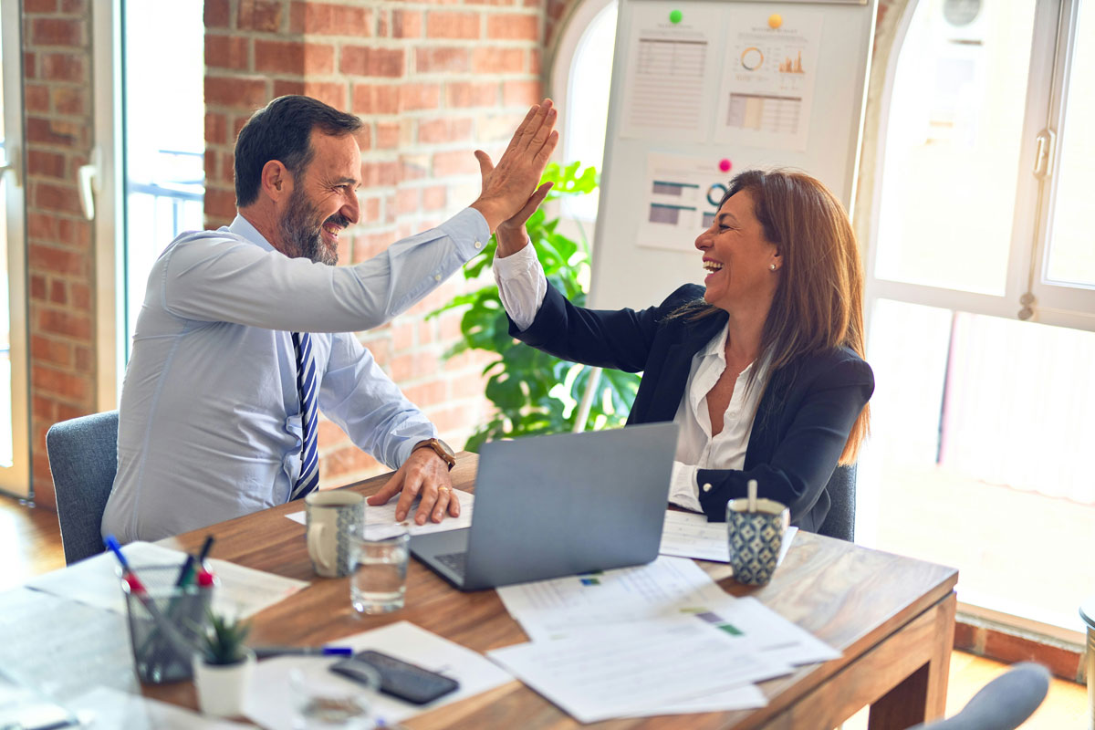 man and woman doing high five